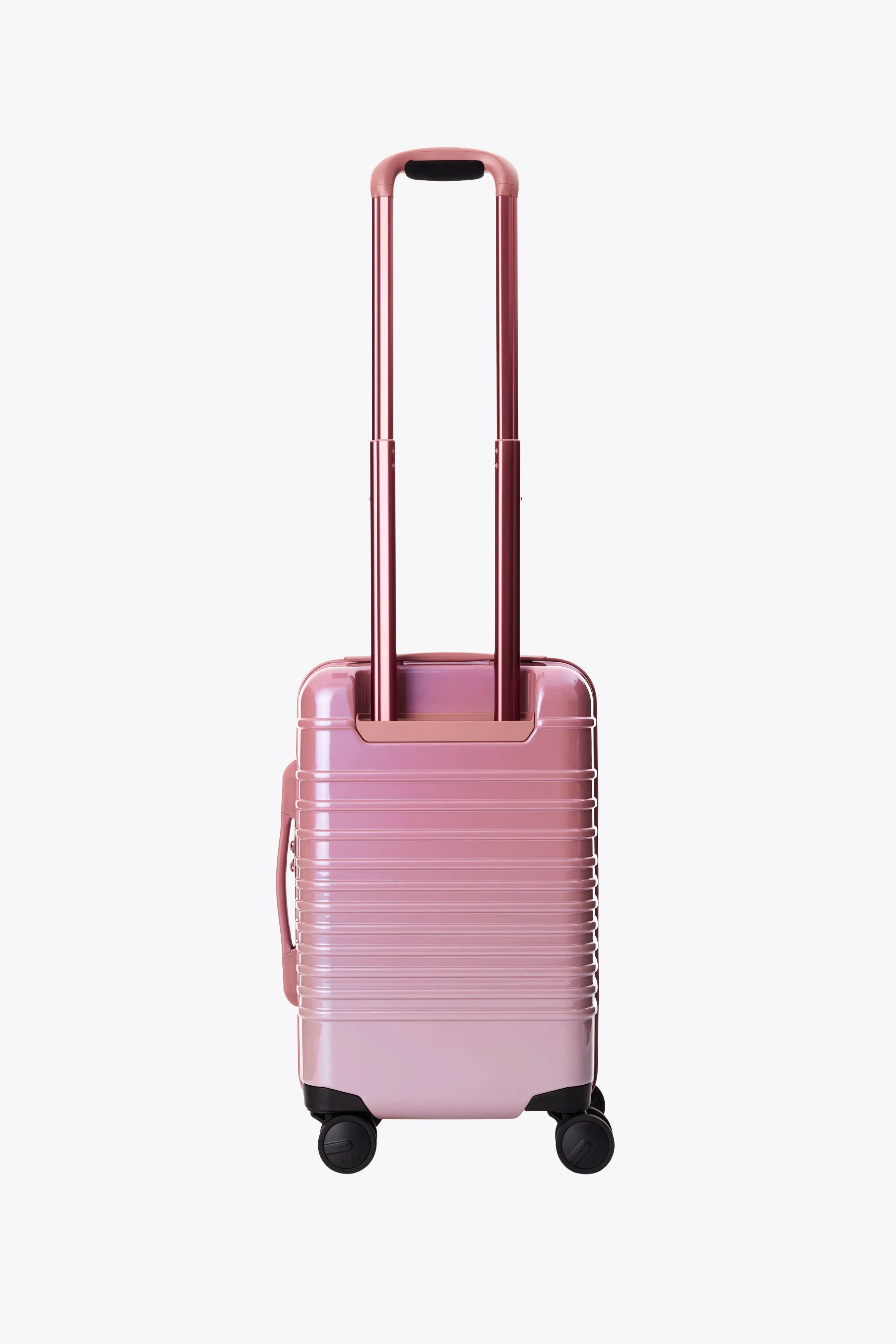 The Small Carry-On Roller in Wicked Pink